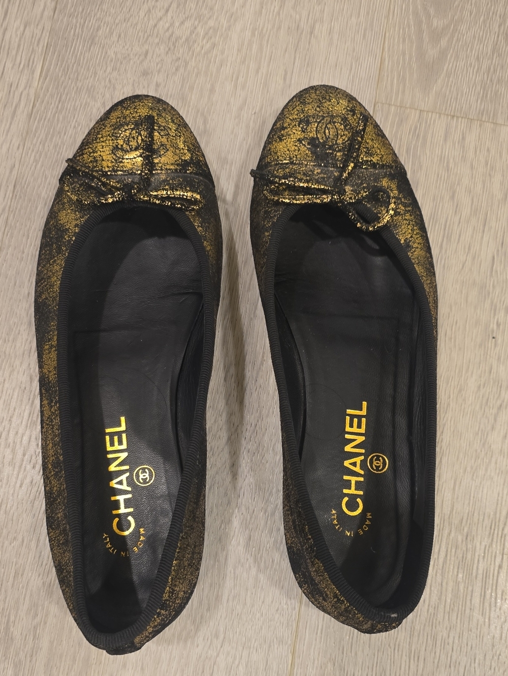 CHANEL Black and Gold Distressed Ballet Flats